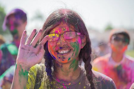 Norwalk, California, USA - March 7, 2015: Unknown women with painted face during the Holi Festival of Colorsのeditorial素材