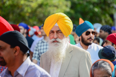 Los Angeles, CA, USA - April 5, 2015: Devotee Sikh with yellow turban marching at the Anniversary of Baisakhi celebration.のeditorial素材