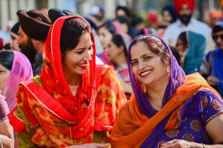 Los Angeles, CA, USA - April 5, 2015: Devotee Sikhs women smiling and  marching at the Anniversary of Baisakhi celebration.のeditorial素材