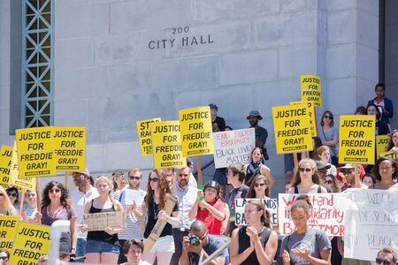 Los Angeles CA USA  May 02 2015: Group of people holding signs during march against the death of Freddie Gray a man of Baltimore who was seriously injured in police custody.のeditorial素材