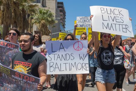 Los Angeles CA USA  May 02 2015: Group of people holding signs during march against the death of Freddie Gray a man of Baltimore who was seriously injured in police custody.のeditorial素材