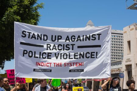 Los Angeles CA USA  May 02 2015: Group with banners and posters during march against the death of Freddie Gray a man of Baltimore who was seriously injured in police custody.のeditorial素材