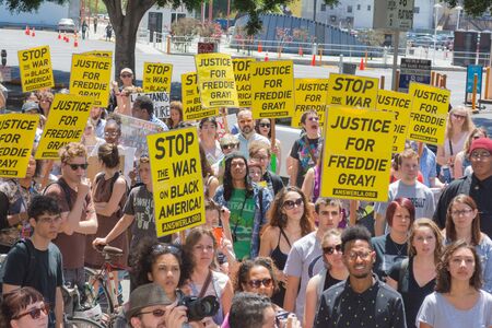 Los Angeles CA USA  May 02 2015: Group of people holding signs during march against the death of Freddie Gray a man of Baltimore who was seriously injured in police custody.のeditorial素材