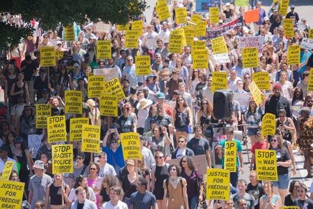 Los Angeles CA USA  May 02 2015: Protestants in the streets with signs during march against the death of Freddie Gray a man of Baltimore who was seriously injured in police custody.のeditorial素材