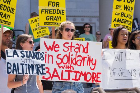 Los Angeles CA USA  May 02 2015: Group of people holding signs during march against the death of Freddie Gray a man of Baltimore who was seriously injured in police custody.のeditorial素材