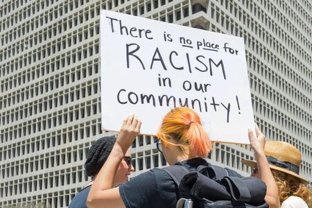 Los Angeles CA USA  May 02 2015: Woman raising a sign in march against the death of Freddie Gray a man of Baltimore who was seriously injured in police custody.のeditorial素材