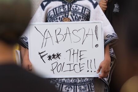 Los Angeles, USA - July 12, 2016 -  Black lives matter protestor holding a poster during march on City Hall following ruling on LAPD fatal shooting of African American female Redel Jonesのeditorial素材