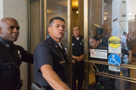 Los Angeles, USA - July 12, 2016 - Officers during march on City Hall following ruling on LAPD fatal...