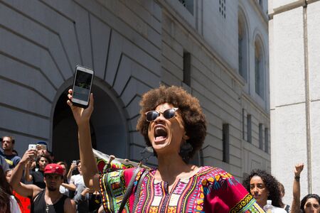 Los Angeles, USA - July 12, 2016 -  Black lives matter protestor shouting during march on City Hall following ruling on LAPD fatal shooting of African American female Redel Jonesのeditorial素材
