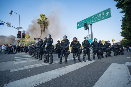Los Angeles, USA â June 8, 2025: Los Angeles riot police standing by during a downtown demonstration against expanded ICE operations and in support of immigrant rightsの写真素材