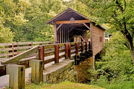 An old covered bridge spans a creek 