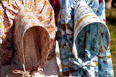 Handmade bonnets at a crafts festival.