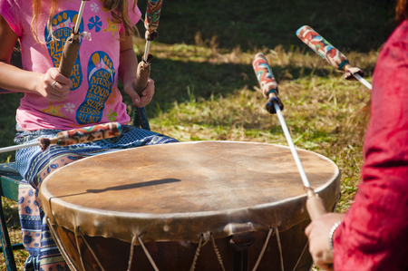 Small child playing an Indian Drum.の写真素材