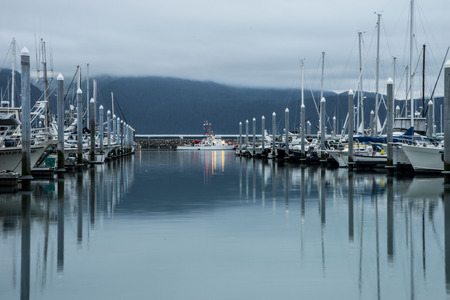 Fishing boats line up in the bay of Seward, Alaska.のeditorial素材