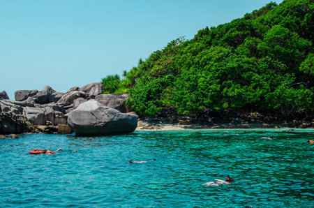 Tropical islands of ocean blue sea water and white sand beach at Similan Islands with famous Sail Rock, Phang Nga Thailand nature landscape. High quality photoの写真素材