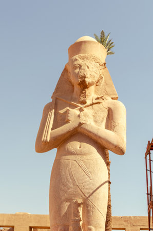 Statue of pharaoh with crossed arms at Karnak Temple in Luxor Egypt 28 February 2025.