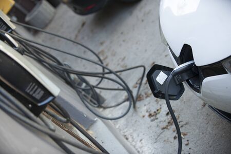 an electric car at a charging stationの写真素材