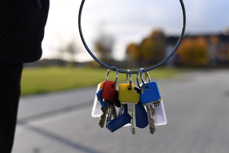 a person holding keys in her hand