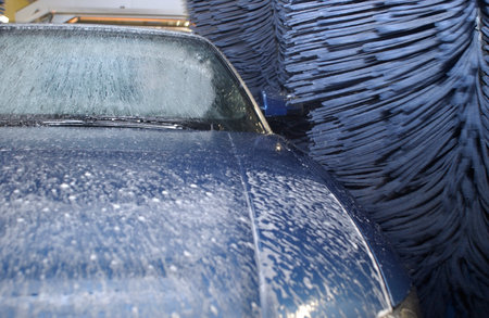 Cleaning car with high pressure water and foam. Cleaning service concept.の写真素材