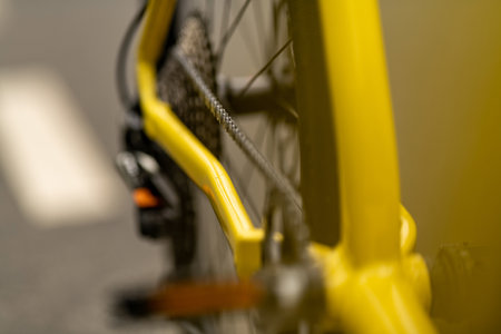 Close up of a yellow bike. Blurred background. Selective focus.