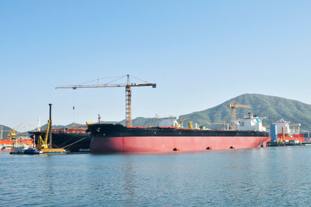 A large ship under construction at the shipyard.の写真素材