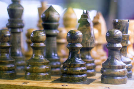 Chess on a chessboard. With selective focus.
