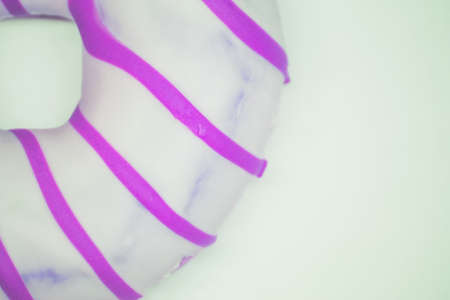 Violet donut top view. White background copy space