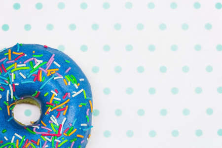 Blue donut on a white and turquoise background copy spaceの写真素材