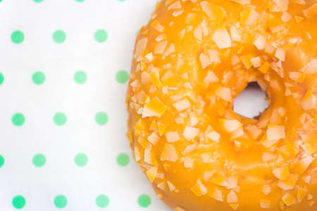 Yellow donut close-up on a white-green background close-up copy spaceの写真素材
