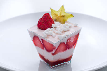 frozen yogurt cake with pieces of strawberry in the cupの写真素材