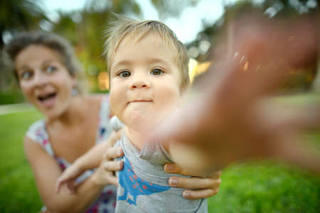 Mom and son who pulls his handsの写真素材