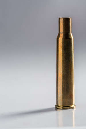 Shoot empty gun shell on a black background shot in studio.の写真素材