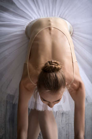 Ballerina in white tutu makes you lean forward. Top view.の写真素材