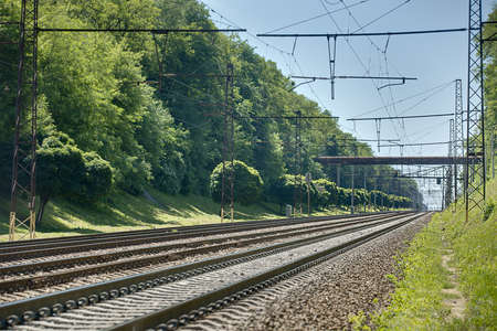Photo railway. Rails perspective on green background summer nature. Kiev, Ukraine.