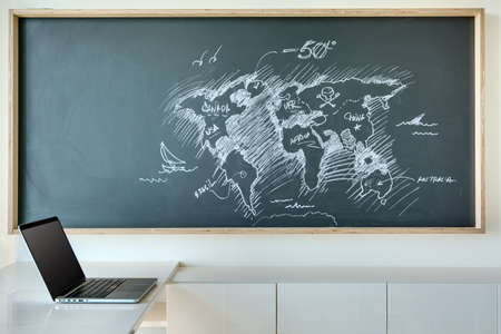 Board for drawing with chalk, which is painted white chalk map of the world in a humorous style....