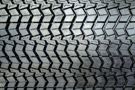 Photo coarse textured black tire tread large truck close-up.の写真素材