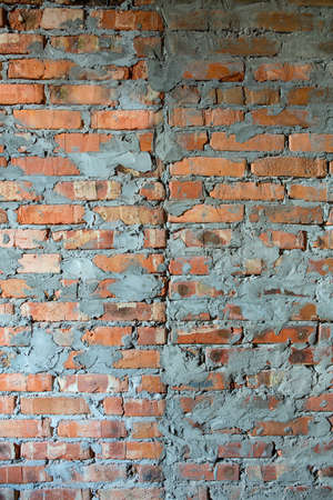 Photo texture of a brick wall. With streaks of cement. Front view. Red brick.の写真素材