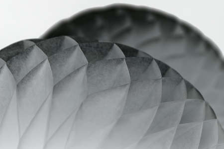 Couple of white origami on the dark background. Close-up photo. Horizontal. Option in a negative inversion.の写真素材