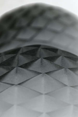 Couple of white origami on the dark background. Close-up photo. Vertical. Option in a negative inversion.の写真素材