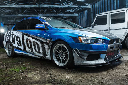 Kiev, Ukraine - 14 May 2014: Mitsubishi Lancer Evolution X tuning sport-car. It colored in blue, gray, whites colors with patterns and prints. Editorial photo.のeditorial素材