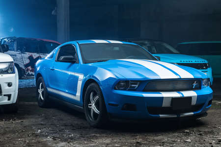 Kiev, Ukraine - 14 May 2014: Ford Mustang tuning sport-car. It colored in blue color with white...