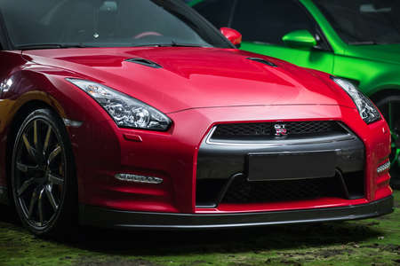 Kiev, Ukraine - 14 May 2014: Nissan GT-R tuning sport-car. It colored in red and black colors. Editorial photo. Closeup front view.のeditorial素材