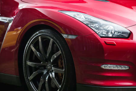 Kiev, Ukraine - 14 May 2014: Nissan GT-R tuning sport-car. It colored in red and black colors. Editorial photo. Shoot from the side. Closeup.のeditorial素材