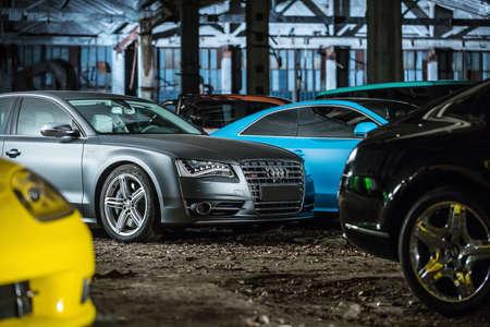 Kiev, Ukraine - 14 May 2014: Audi S8 tuning sport-car on the background of other autos. It colored in gray color. Editorial photo.のeditorial素材