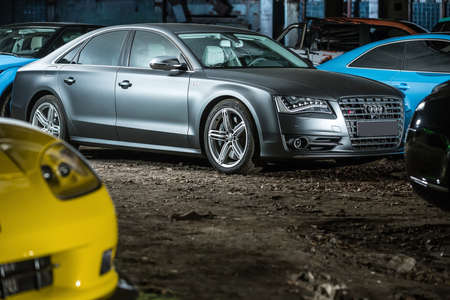 Kiev, Ukraine - 14 May 2014: Audi S8 tuning sport-car on the background of other autos. It colored in gray color. Editorial photo.のeditorial素材