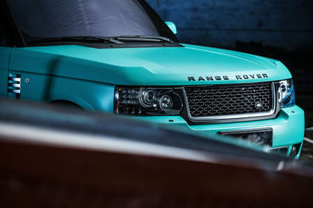 Kiev, Ukraine - 14 May 2014: Range Rover Freelander tuning sport-car. It colored in turquoise color. Editorial photo. Closeup front view.のeditorial素材