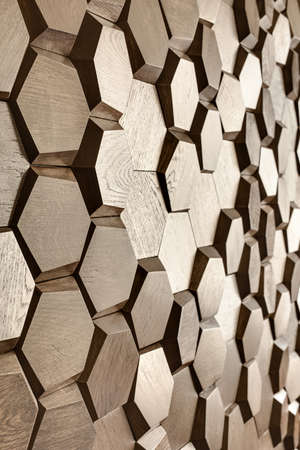 Design wooden wall textured with a lot of the hexagons. Closeup. Indoors. Vertical.の写真素材