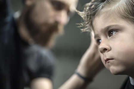 Little boy in barbershopの写真素材