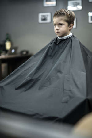 Little boy in barbershopの写真素材