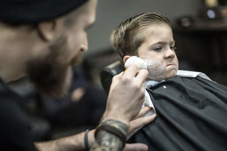 Funny shaving of little boyの写真素材